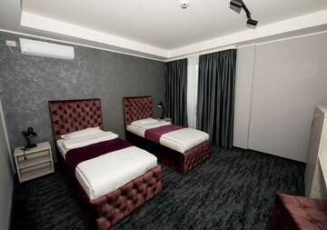 Фото номера Двухместный номер с 2 отдельными кроватями Отель ZEN Hotel Focșani г. Фокшани 4