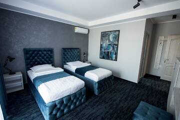 Фото номера Двухместный номер с 2 отдельными кроватями Отель ZEN Hotel Focșani г. Фокшани 5